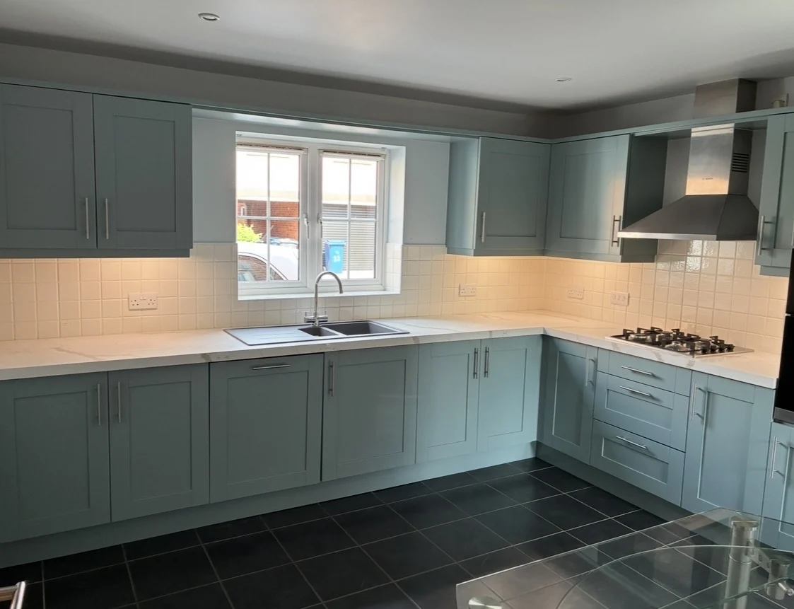 Blue shaker kitchen after respray
