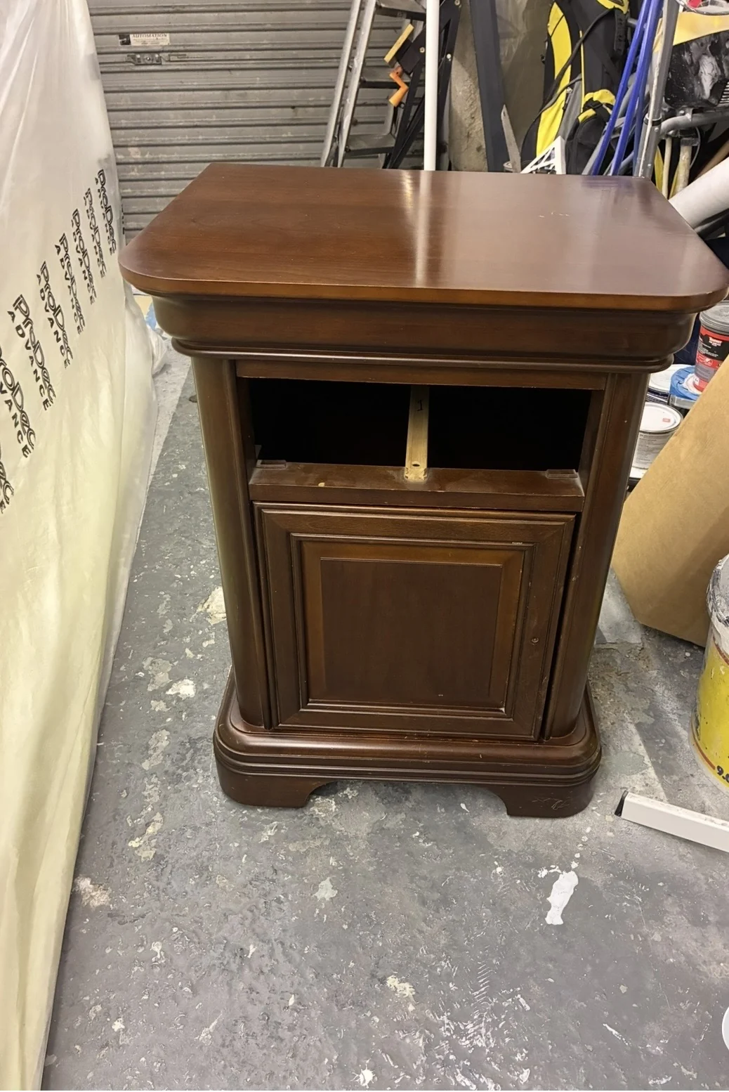 Dark wooden bedside cabinet before spraying